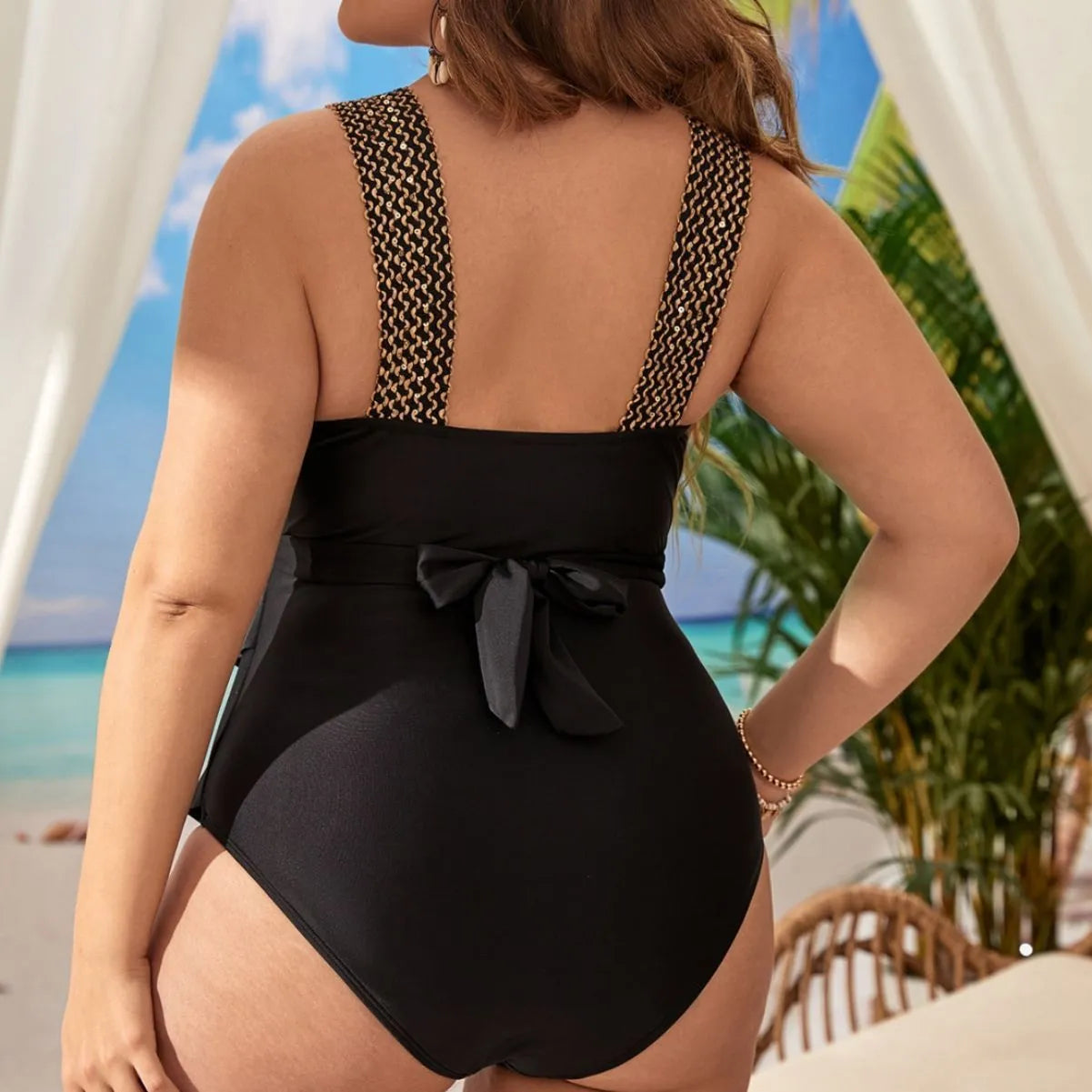 Women's black one-piece swimsuit with integrated chest pad, shown on a mannequin.