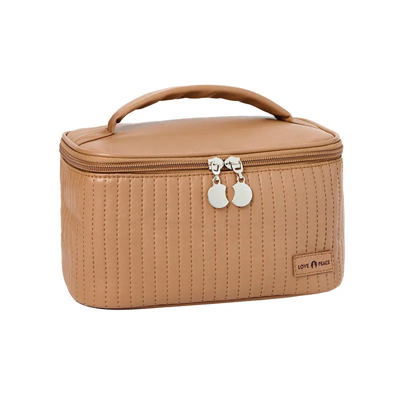 Open-top cake-shaped women's makeup bag in PU leather, shown in a choice of six solid colours.