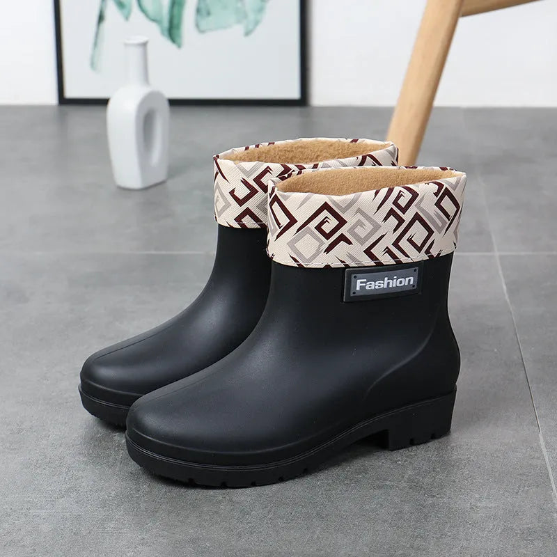 Women's mid-calf PVC rain boot in black, shown with a low heel and optional wool lining.