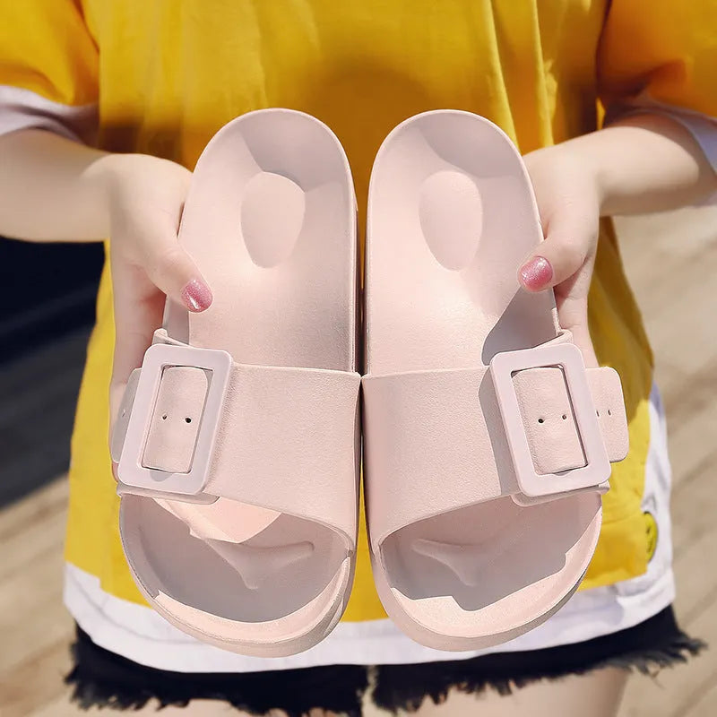 Women's grey blue EVA flip-flops with a buckle strap on a soft sole.