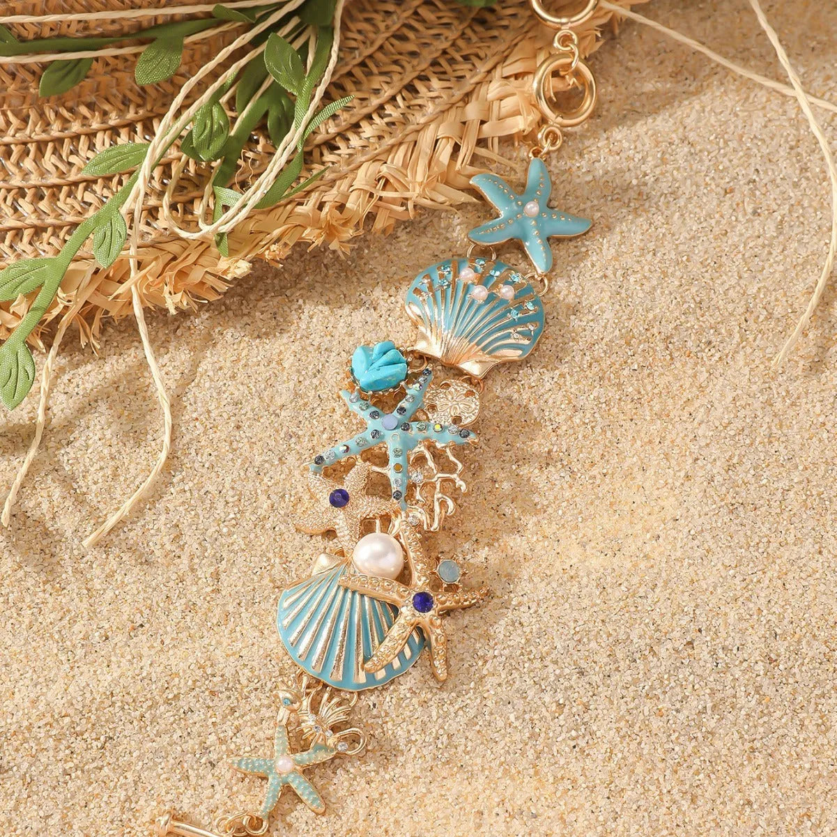 Alloy rhinestone starfish bracelet with boat anchor charm in blue, red, or turquoise.