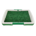 Green artificial turf dog toilet tray with three-layer construction for indoor puppy training.