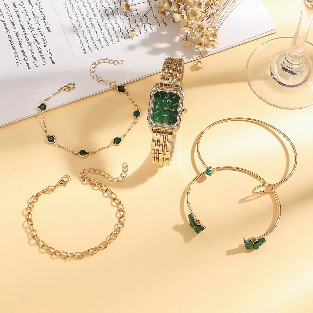 Gold green square women's watch with four matching bracelets on a white background.