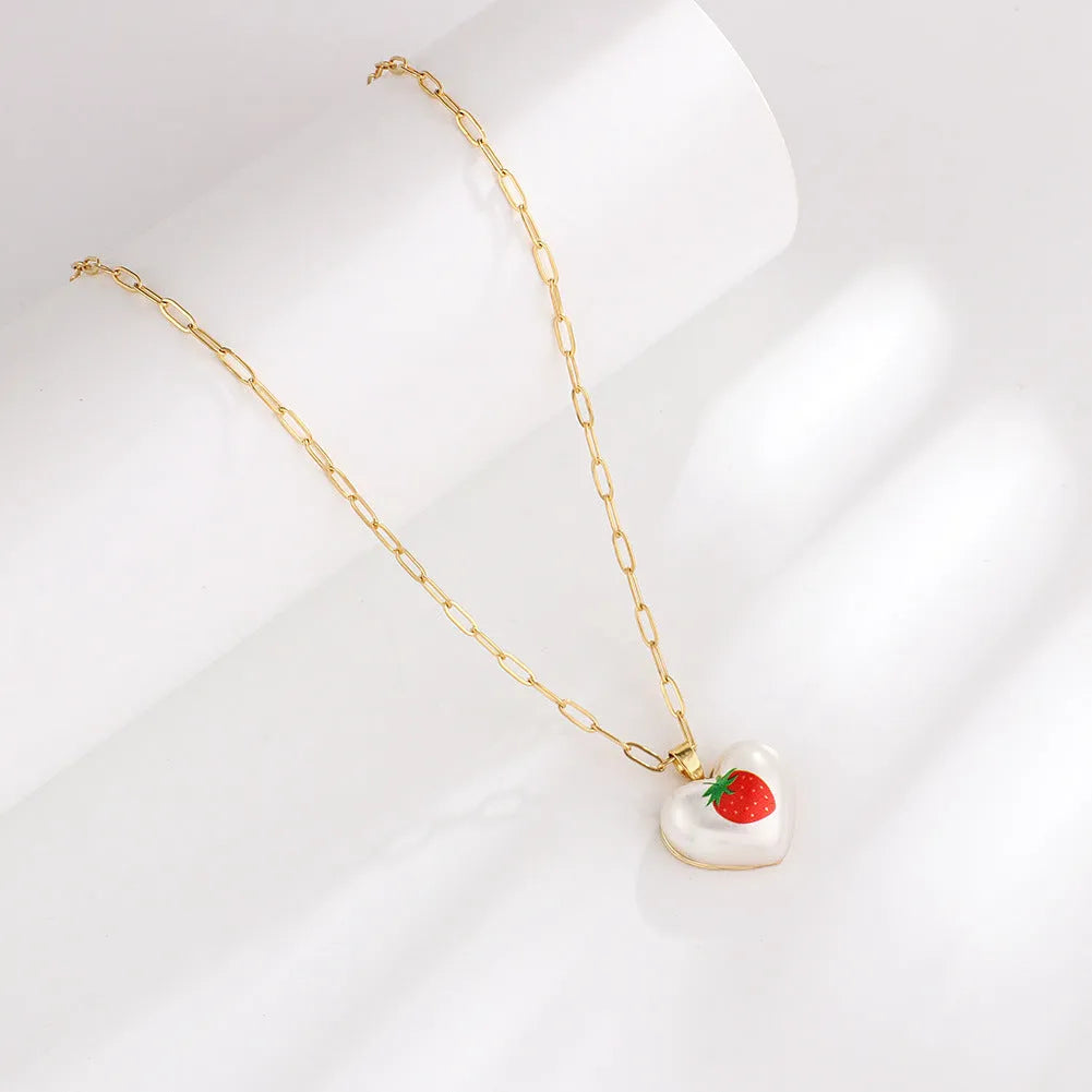 Adjustable girls necklace with a choice of apple, cherry, pear, pineapple, or strawberry heart-shaped pendant.