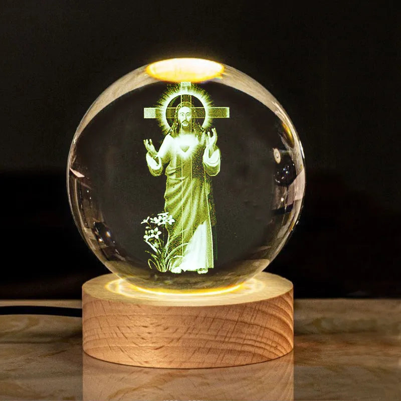 White crystal ball with cross and religious symbols on wooden LED base desk ornament