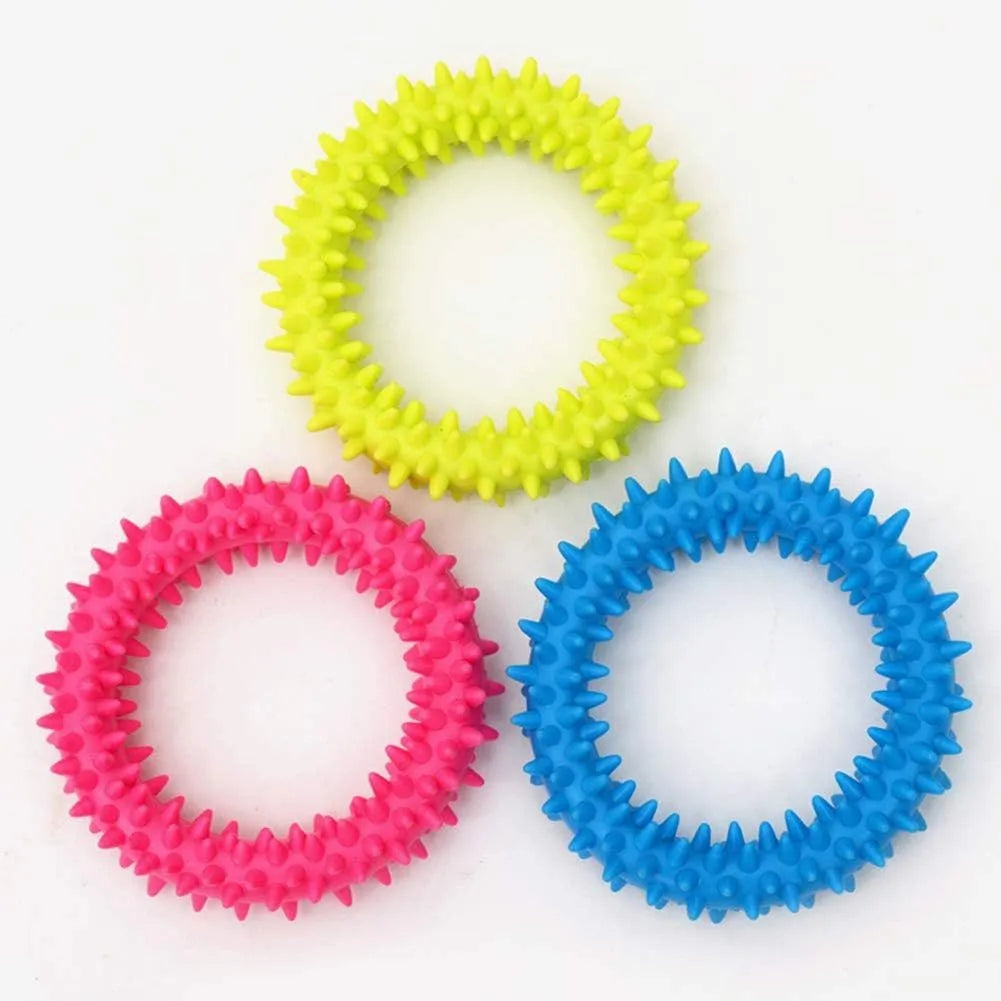 Blue TPR spiky circle dog chew toy for dental cleaning on a white background.