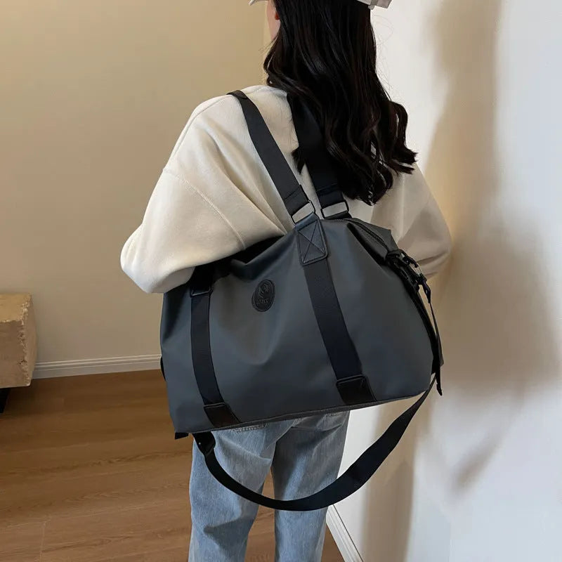 Waterproof Oxford cloth travel bag with 36-55 litre capacity in solid colour design