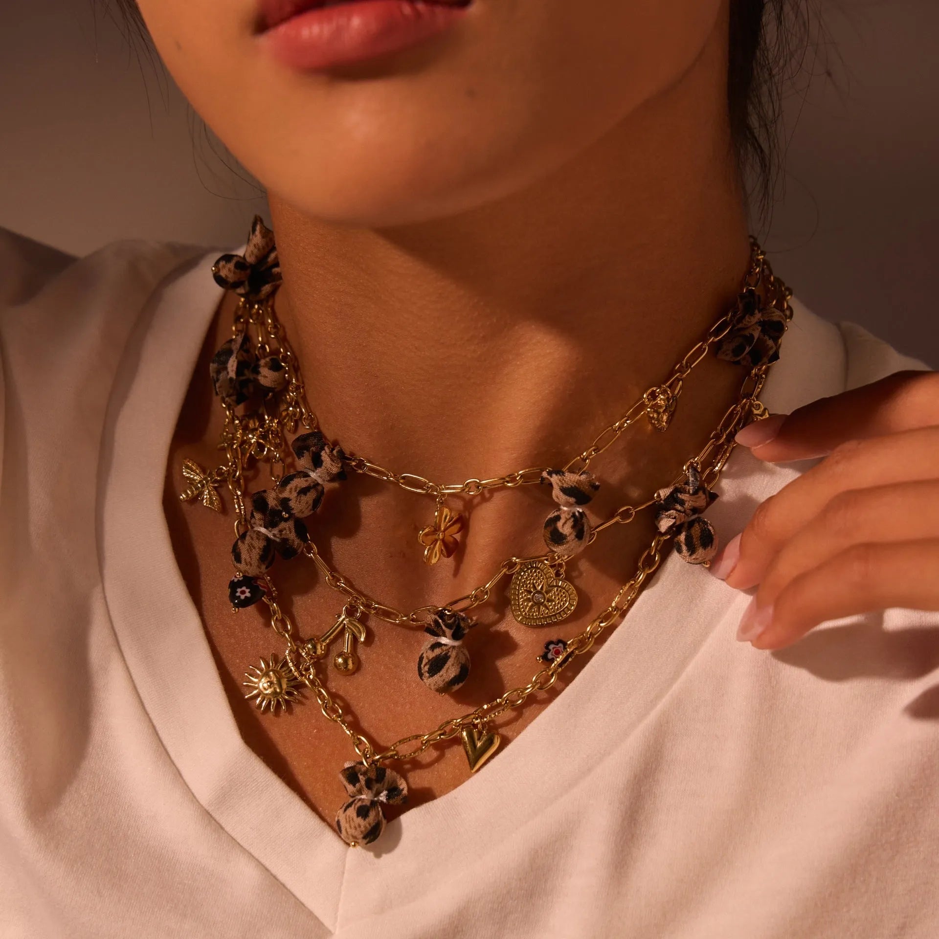 Leopard, love heart, and flowers design on a geometric stainless steel pendant necklace with an adjustable chain.