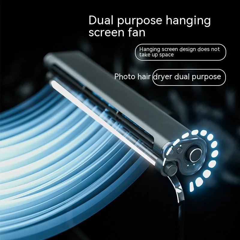 Black clip-on bladeless USB fan attached to laptop screen with LED light illuminated