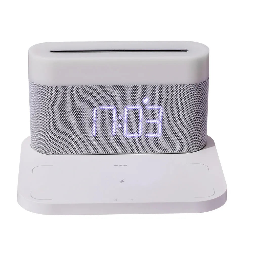 Black wireless charging desktop station with digital clock display and night light function