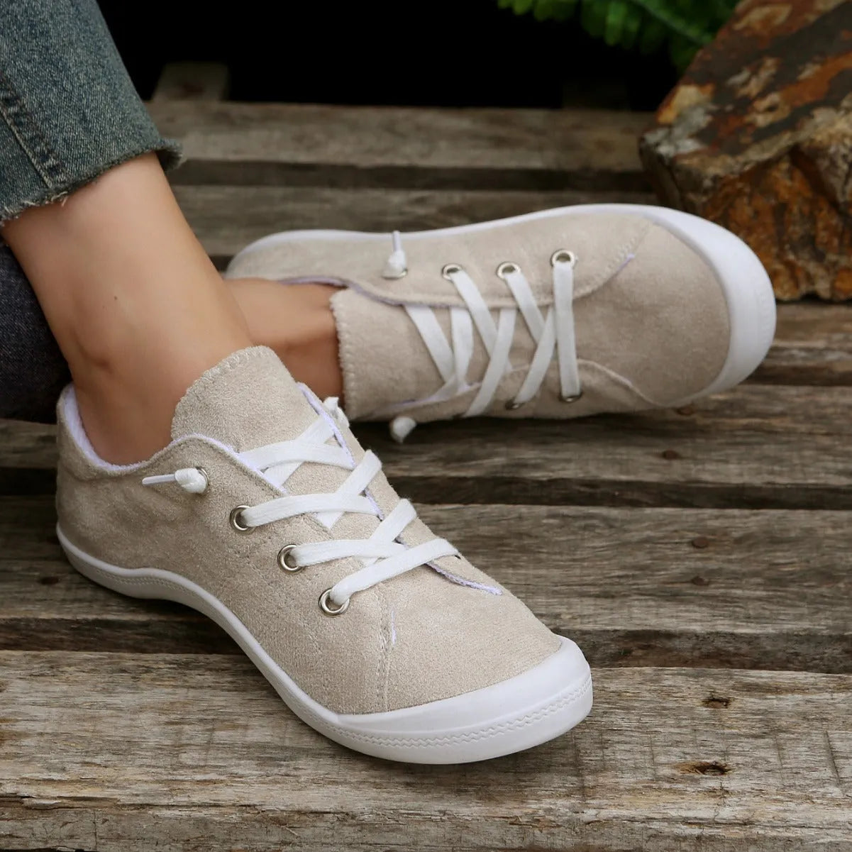 Women's creamy-white fabric low-top casual sneaker with rubber sole