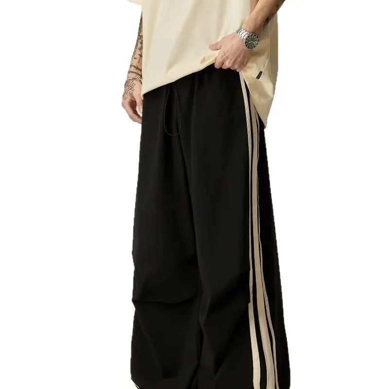 Black men's wide-leg climbing trousers with high waist and straight cut in polyester fabric