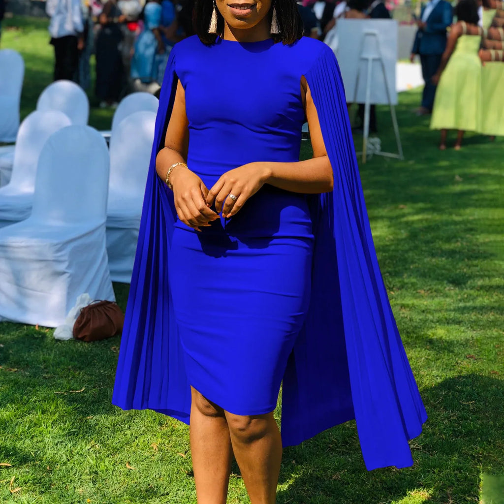 Long sleeve high waist evening gown with a round neck and pleated shawl detail.