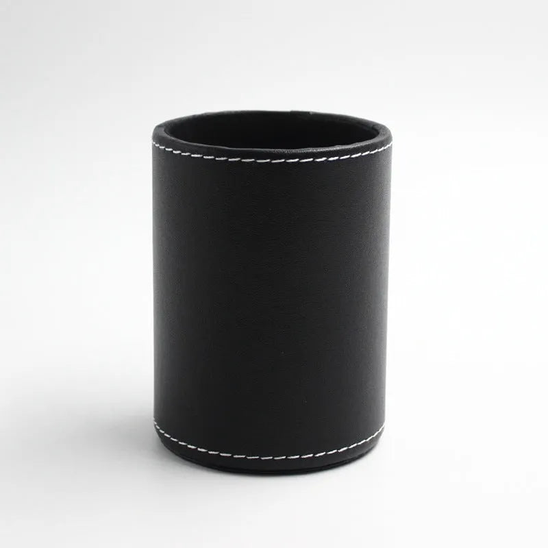 Round black leather pen holder showing cylindrical shape for desk organisation