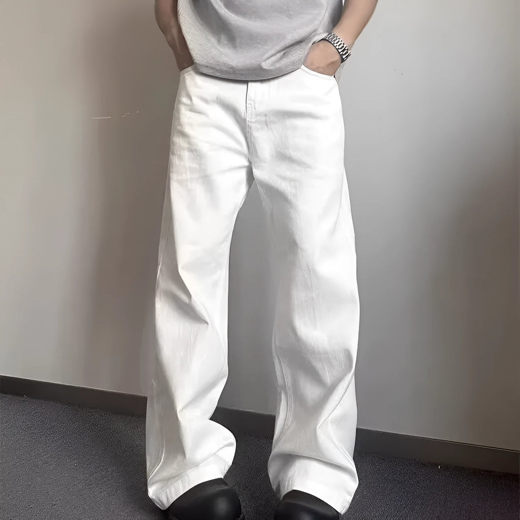 Men's white straight leg wide fit cotton denim jeans on a hanger