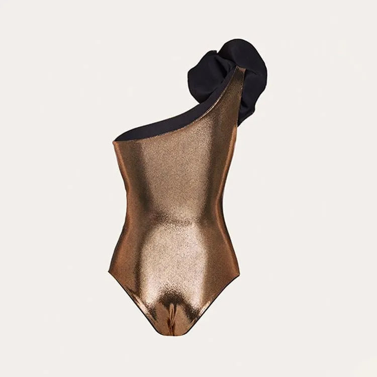 Handmade gold halter neck one-piece swimsuit with hollow out design on a mannequin.