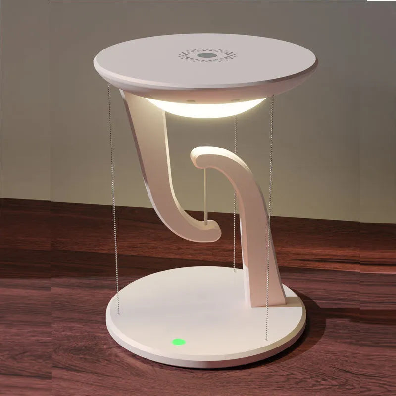White creative smart wireless phone charger suspension lamp on desk with USB cable