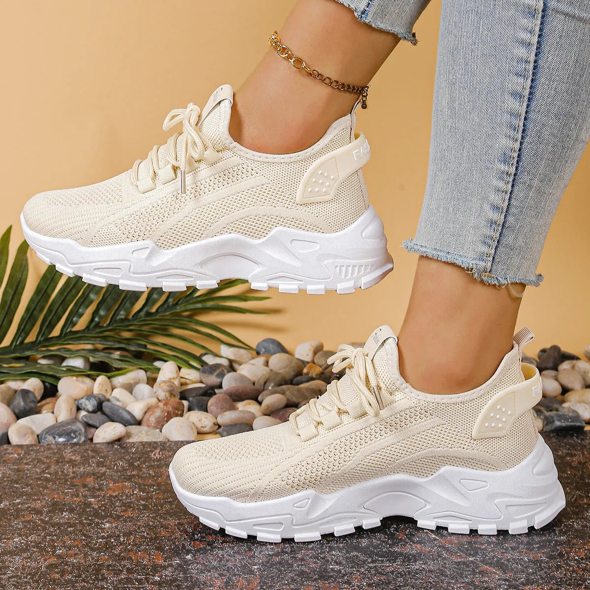 Women's low-top mesh sneakers in various colours with a platform sole and front lace-up design.