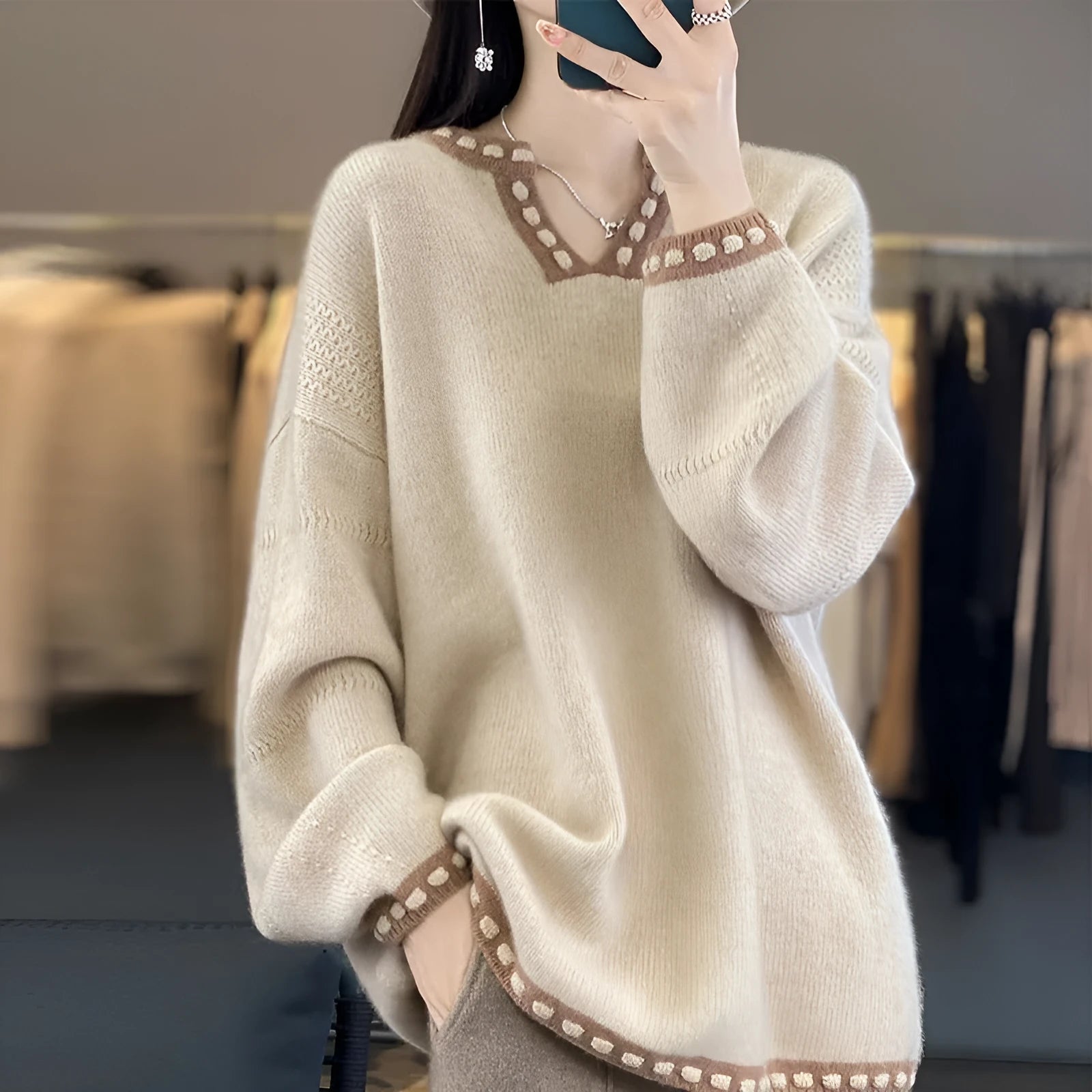 Women's camel V-neck viscose sweater with long sleeves on hanger
