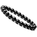 A geometric black onyx bracelet for women with 8mm beads on an elastic cord.