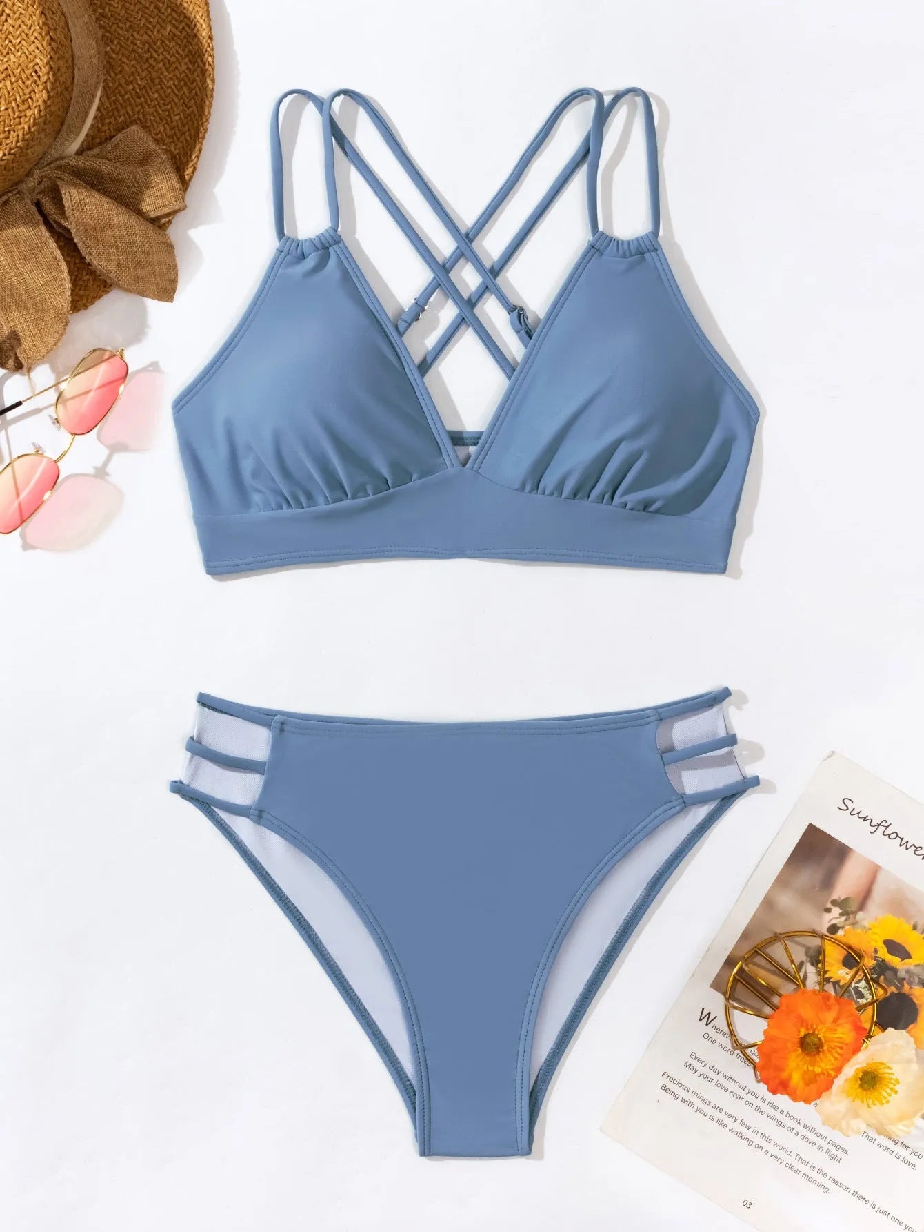 Women's black V-neck halter bikini with split-style shorts on a mannequin.
