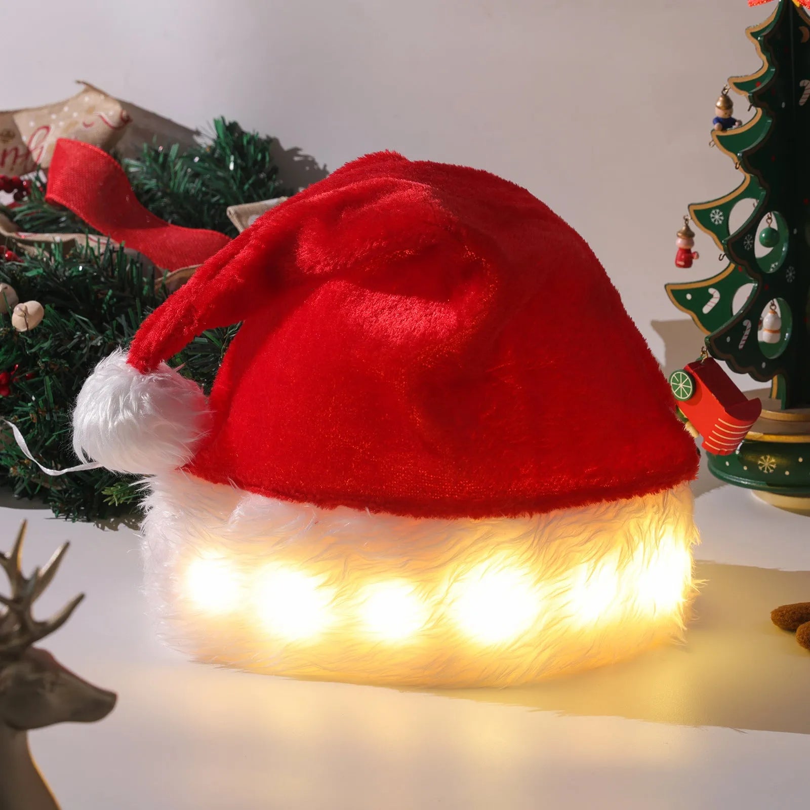 Red and white plush Santa hat with illuminated multi-coloured LED lights and a white pom-pom.