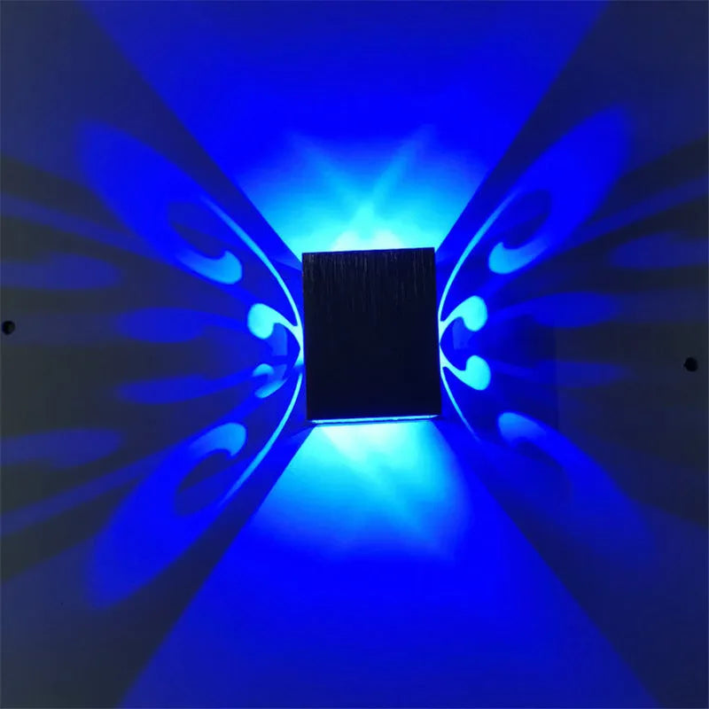 Modern aluminium LED butterfly wall lamp with remote control for seven colour options on interior wall