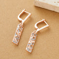 A pair of rectangular hollow geometric stud earrings with a two-tone colour finish on alloy posts.