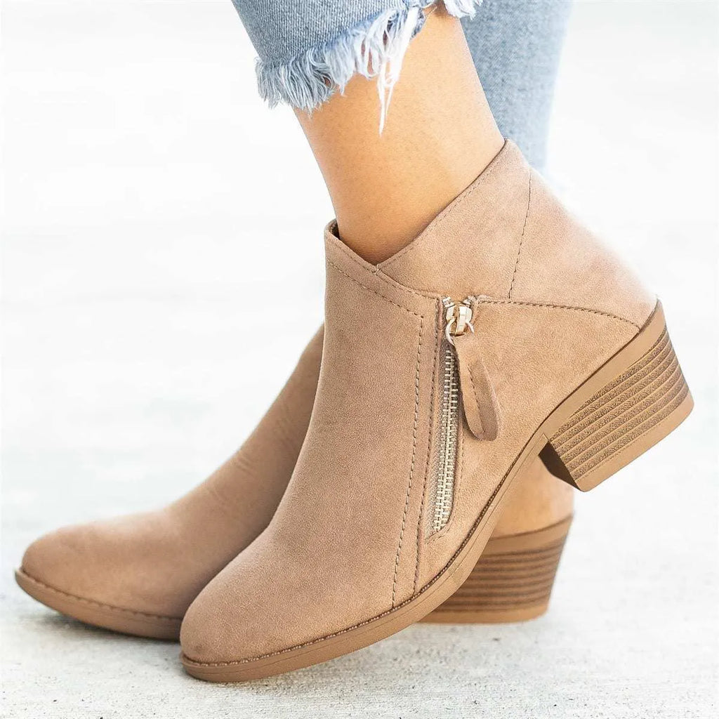 Women's suede ankle boots with side zip and chunky heel in beige, black, blue, or orange.