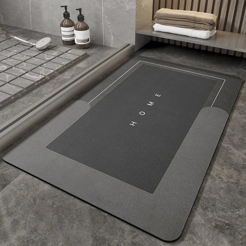 Blue oval blended fabric bathroom floor mat on a tiled floor