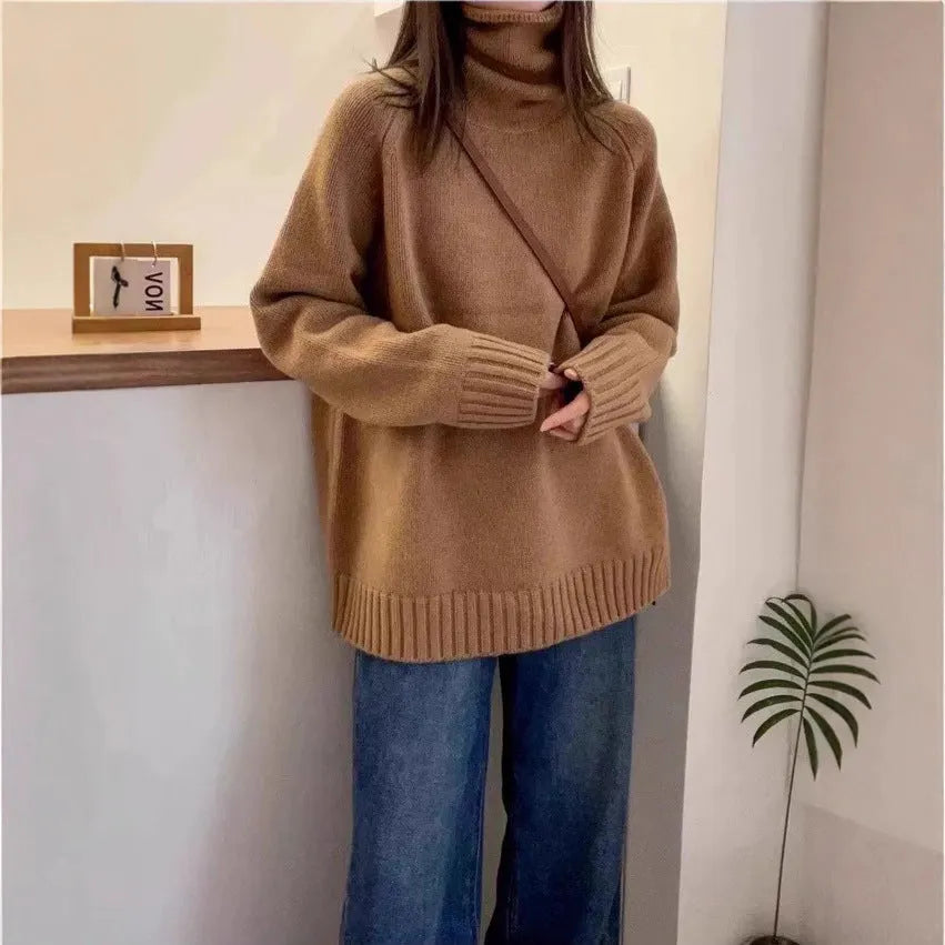 Red women's loose turtleneck sweater with a thick, textured curling pile collar.