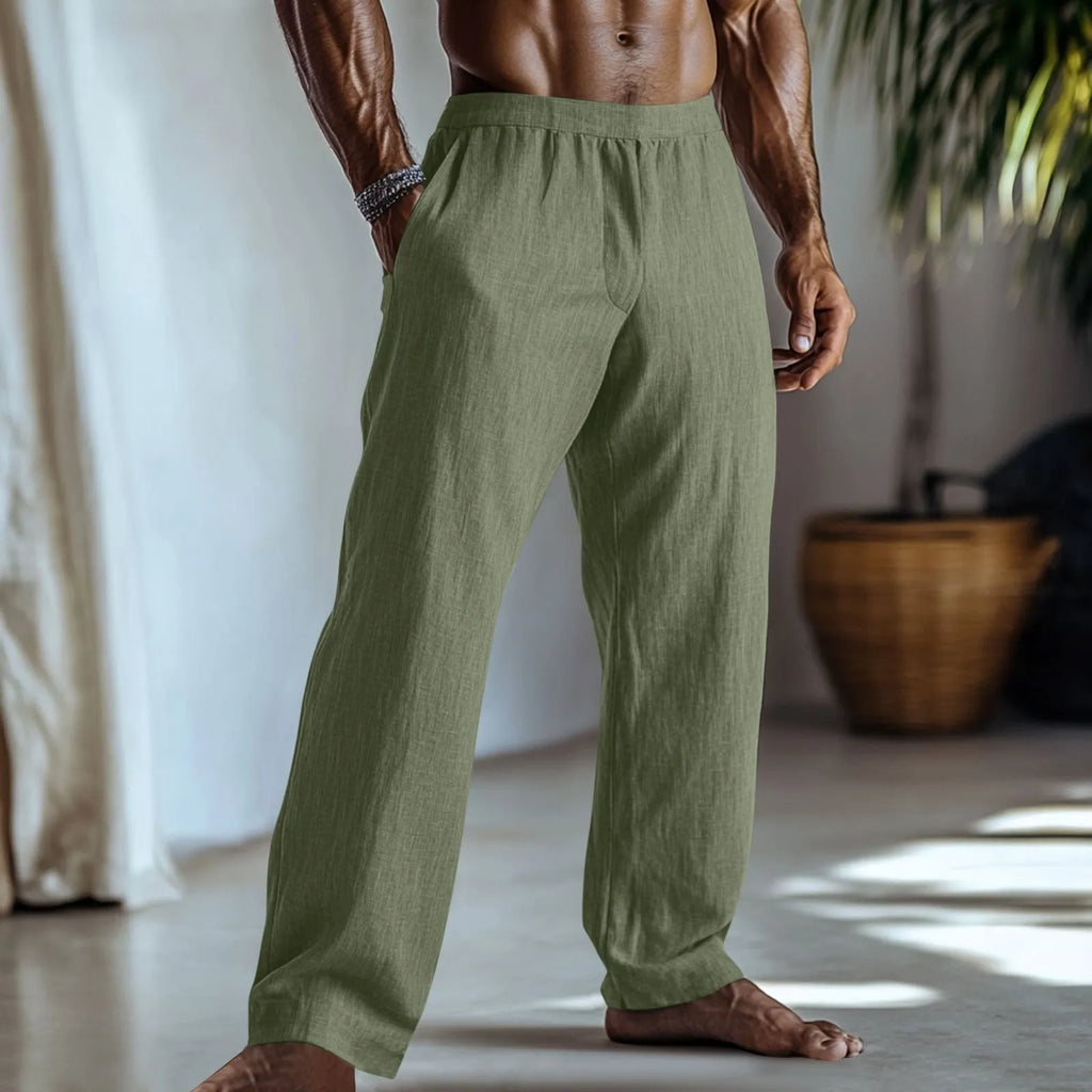 Straight-leg cotton and linen casual trousers in light green colour with visible pockets.
