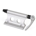 Silver metal quick release clamp for attaching a rack to a bicycle front fork.