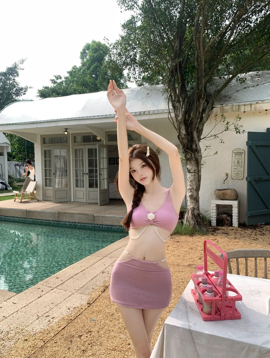 Black or pink bear vacation themed three-piece bikini swimsuit set for swimming.