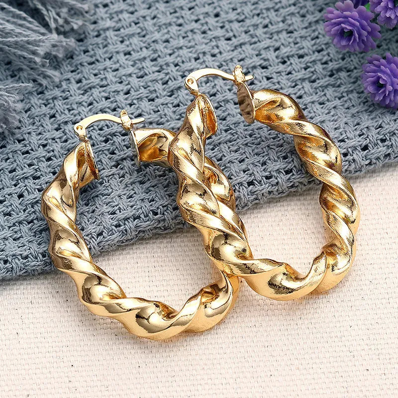 Women's geometric ring design ear clip earrings with drop-shaped elements and electroplated copper construction