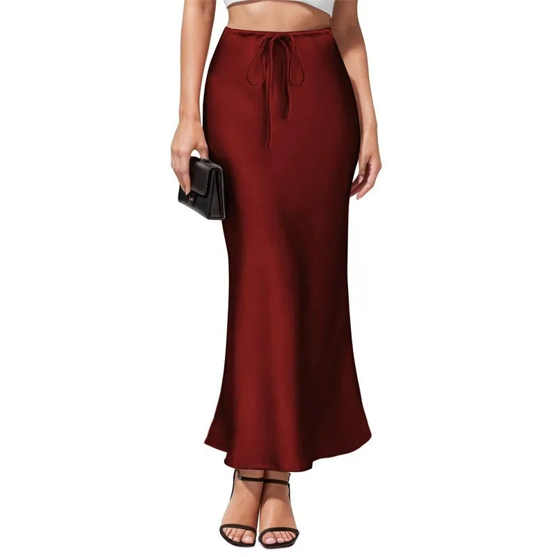 Asymmetric acetate satin skirt in milky white showing high waist design and irregular stitching detail