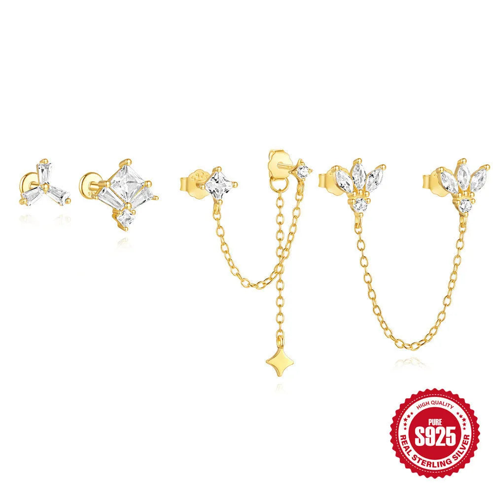 S925 sterling silver geometric stud earrings with inlaid zircon in golden clover, crown, and chain designs.