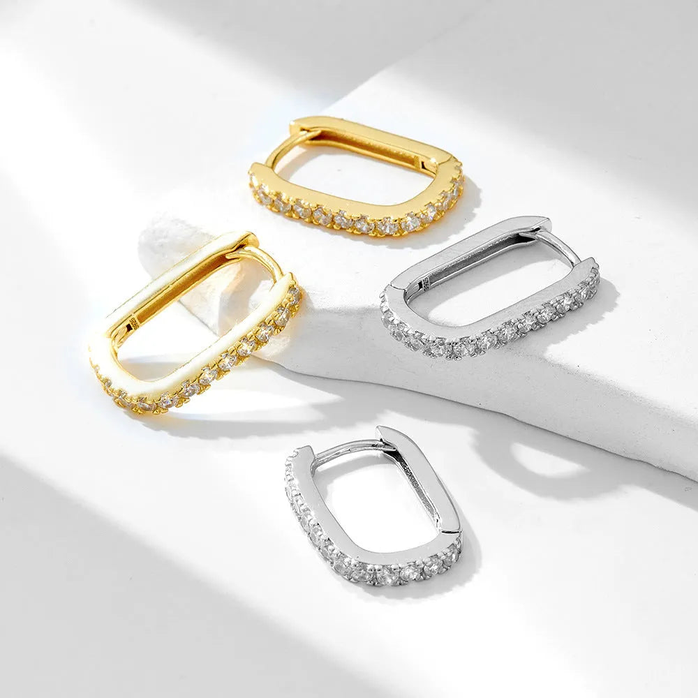 Sterling silver oval zircon ear clips with geometric quadrilateral settings