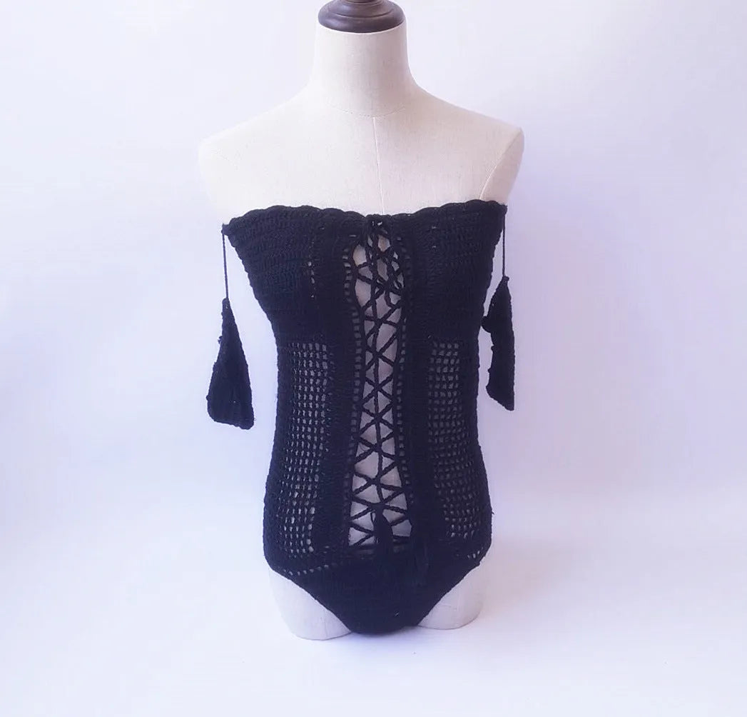 Women's white off-the-shoulder one-piece swimsuit on a mannequin, showing the neckline design.