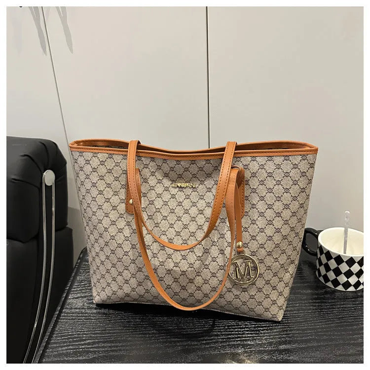 Western style PU leather shoulder bag showing sewing thread detailing, 42cm wide by 28cm tall, available in black, grey, white, and brown colours