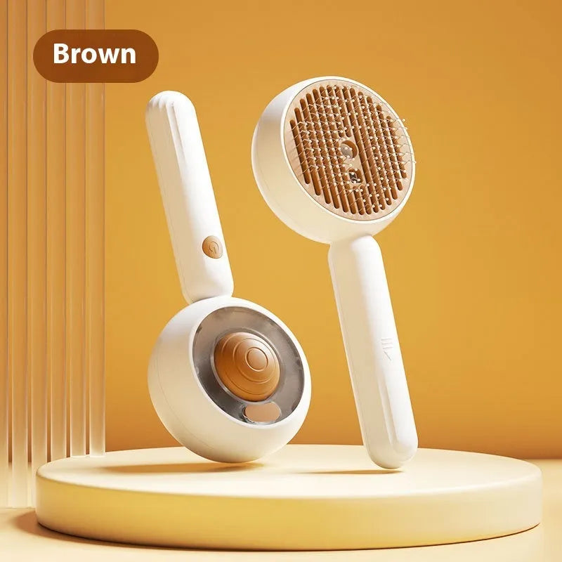 Grey and brown pet spray comb with stainless steel teeth and one-click mechanism on white background