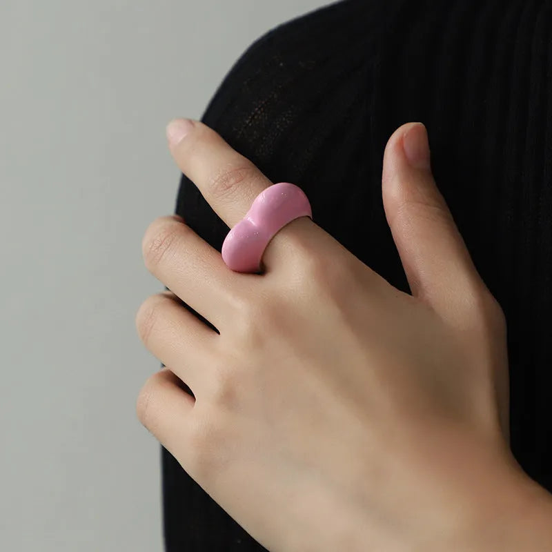 A heart-shaped three-dimensional enamel ring in zinc alloy, shown in one of four available colours.