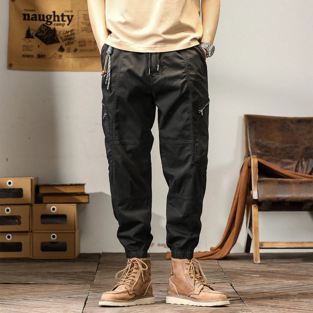 Men's khaki cotton tapered harem pants with an ankle band and loose fit.