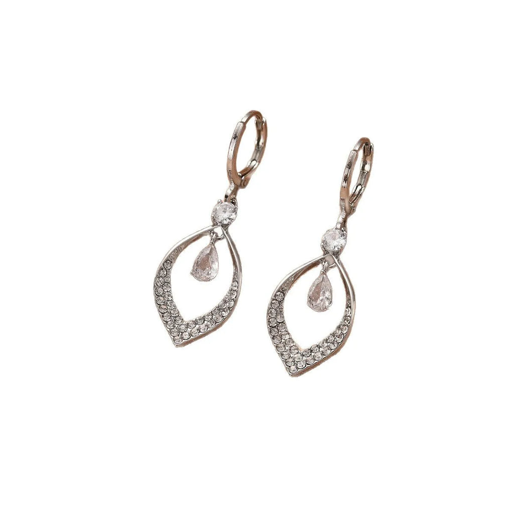 Gold and silver water drop tassel earrings with zircon stones on a copper base.
