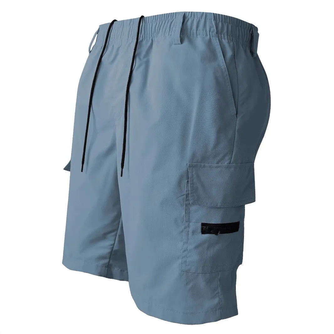 Man wearing loose straight-leg casual shorts in polyester, shown in khaki colour, demonstrating the American sporty style fit.