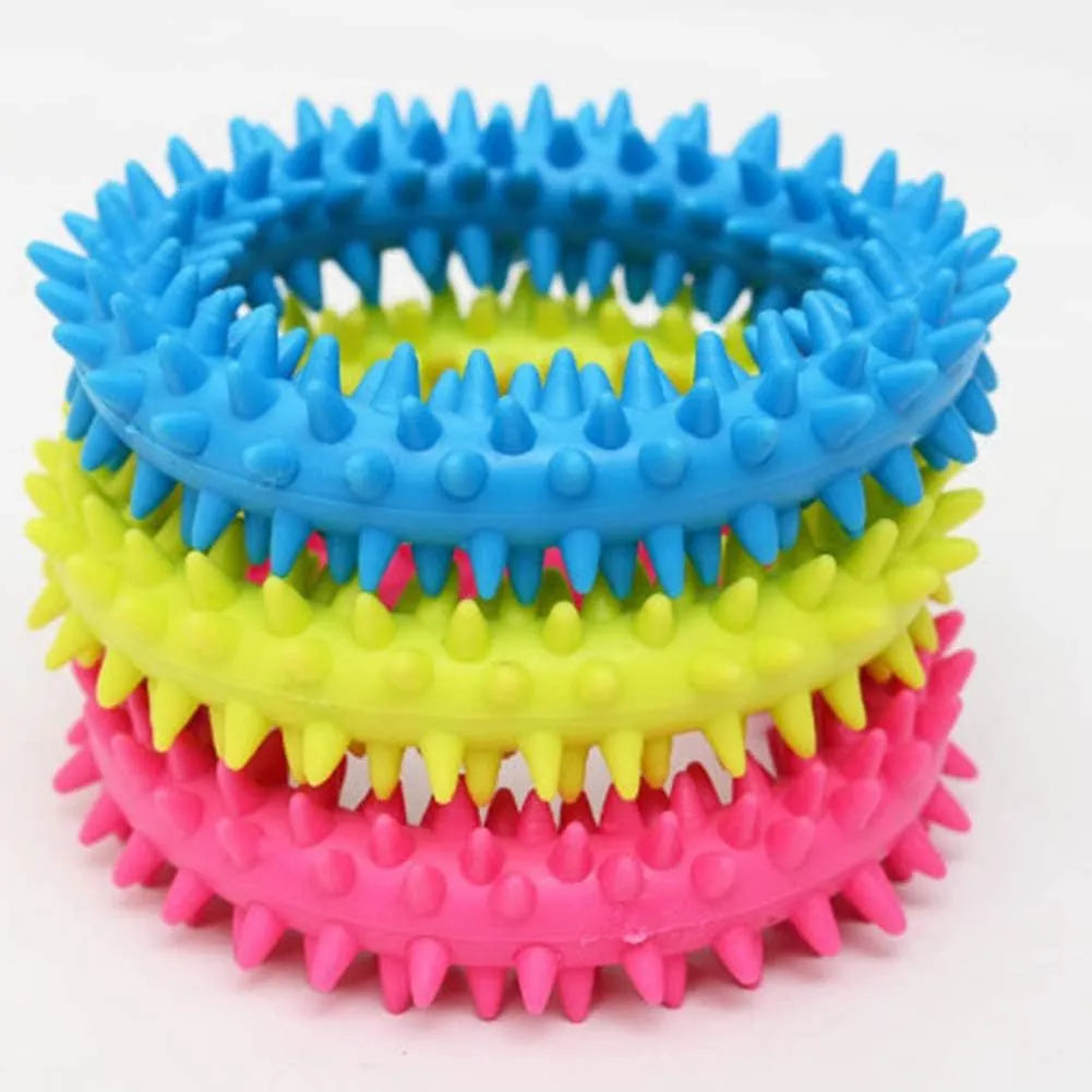 Blue TPR spiky circle dog chew toy for dental cleaning on a white background.