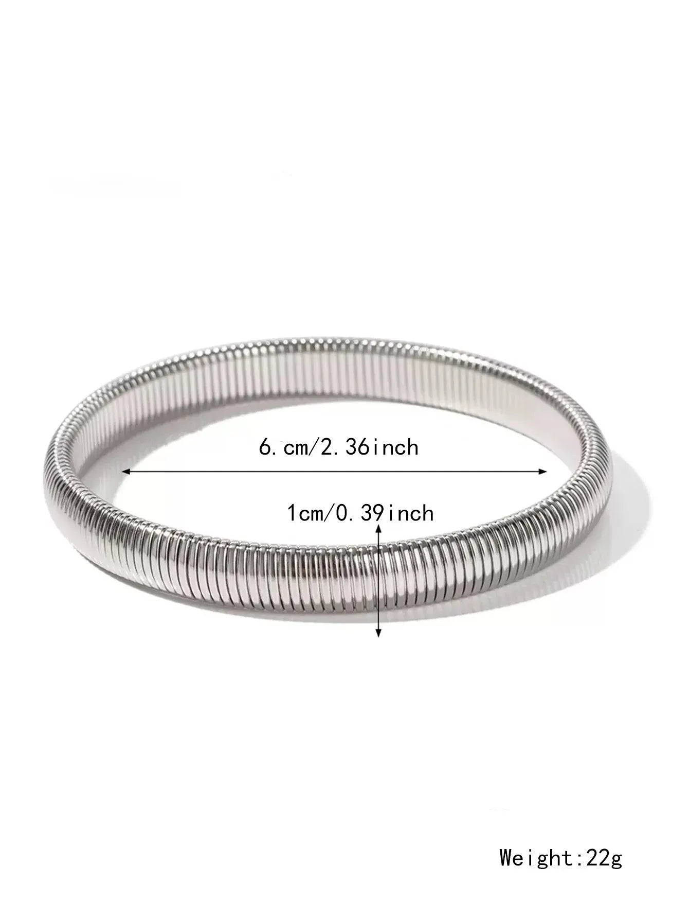 Close-up of a women's elastic titanium steel bracelet featuring a bold vertical stripe ring pattern in a gold tone finish.