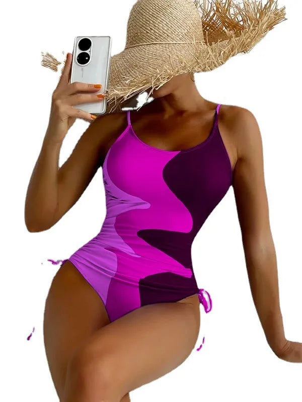 Women's sleeveless one-piece swimsuit in blue colour with backless design for swimming sports