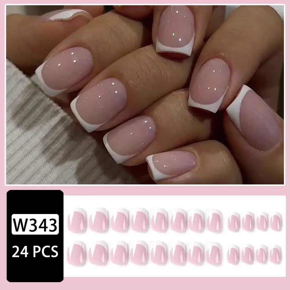 24 white plaid-pattern false nail tips laid out on a surface