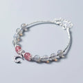 Natural moonstone handmade bracelet with crescent moon charm on wrist showing adjustable clasp